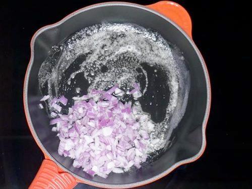 adding onions to fry for pav bhaji