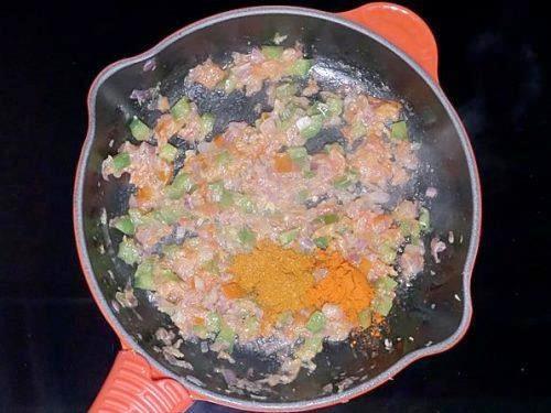 adding masala powder to make pav bhaji recipe