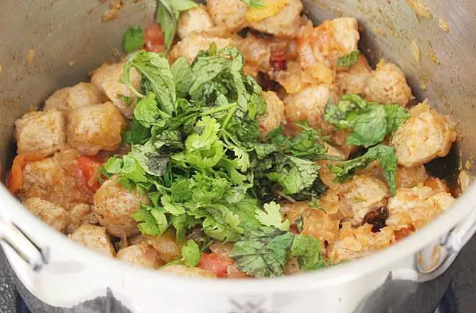 addition of marinade to pan to make soya chunks curry