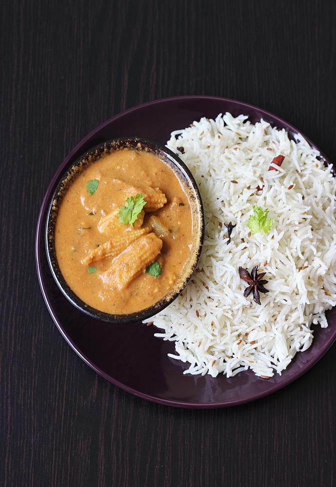 serving garnished baby corn masala gravy
