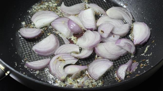 frying onions in pan