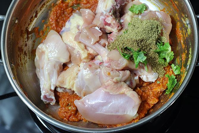 adding garam masala to make chicken curry
