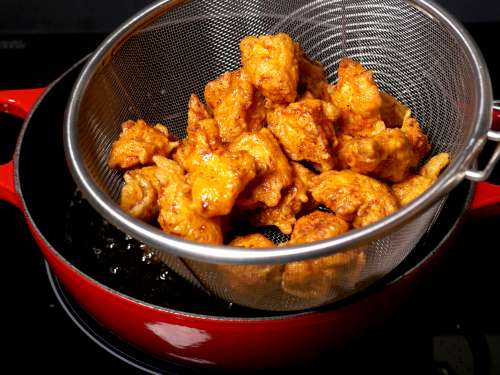 crispy chicken in a colander
