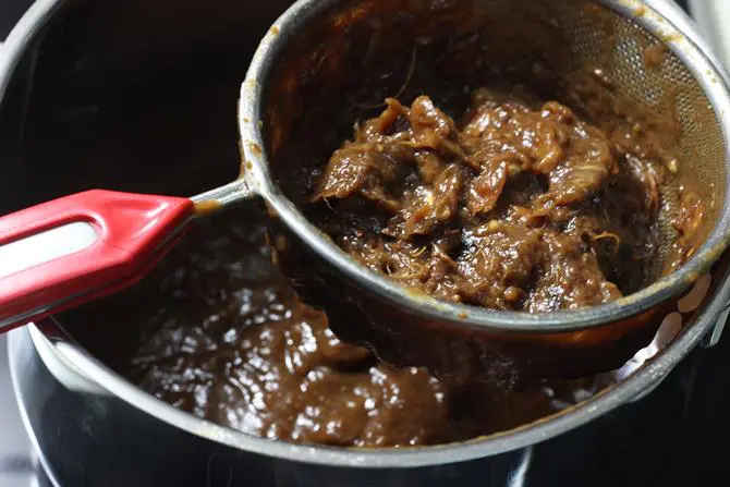 pass pulp through colander to make tamarind paste step 4