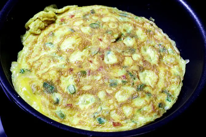 cooking omelette on pan