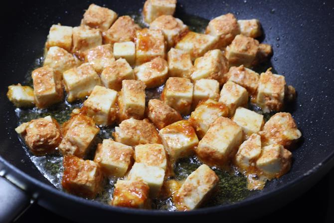 frying marinated paneer 65 in oil