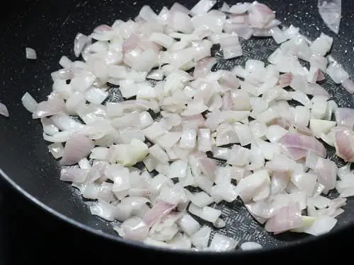 frying onions till pink for paneer butter masala