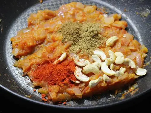 add spice powders to the pan