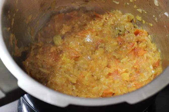 frying onion tomato mixture