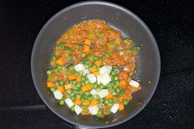 adding boiled veggies