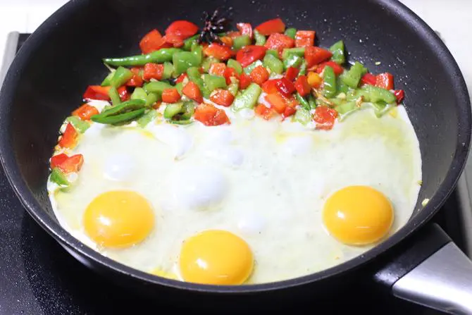 cooking eggs in pan for egg noodles