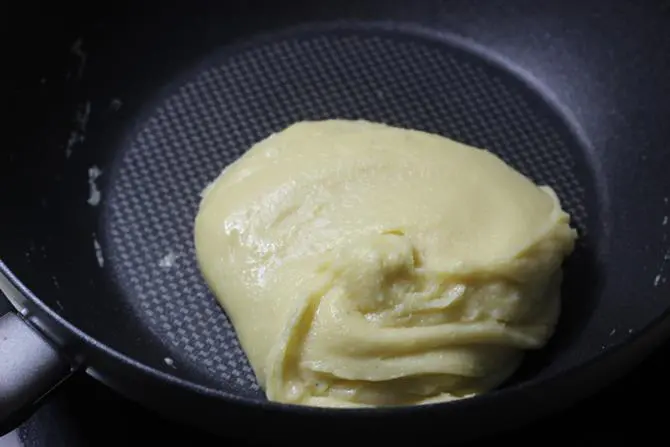 stirring consistently the mixture to make mawa barfi recipe