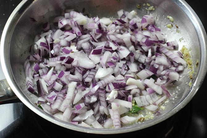 addition of chopped onions to fry in oil to make pepper chicken recipe