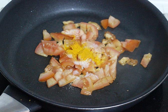 frying tomatoes until mushy to make sorakaya chutney