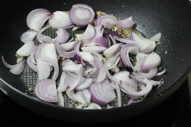 addition of onions to make baby corn fry