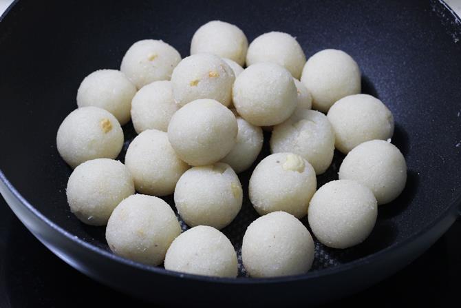rolling mixture to make coconut ladoo