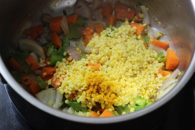 sauteing moong dal with veggies for making oats khichdi