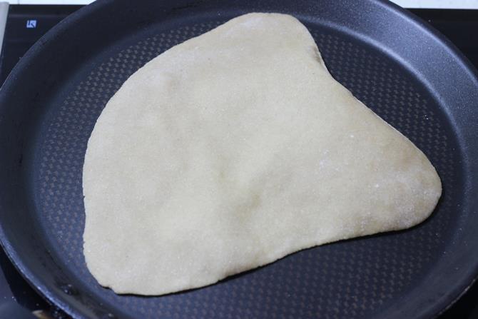 cooking egg paratha recipe on the griddle