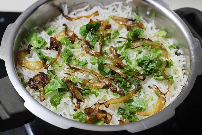 repeat layering cooked rice for fish biryani recipe