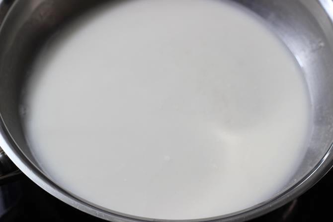 stirring in milk to pot for oats porridge for babies
