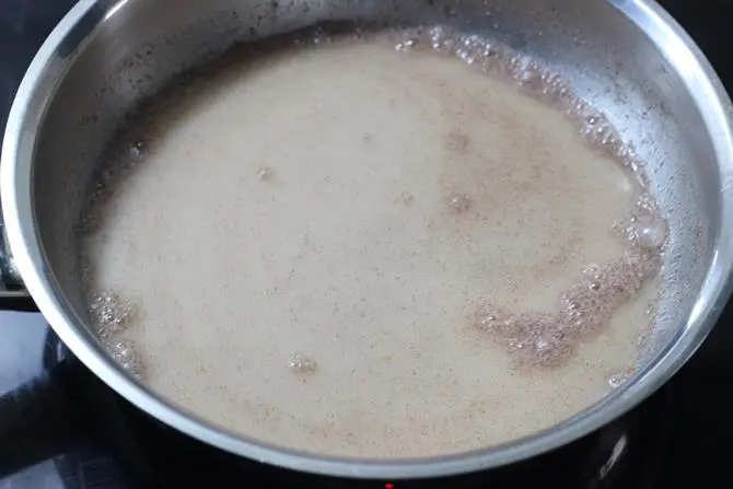 pour water and stir to make ragi porridge for babies