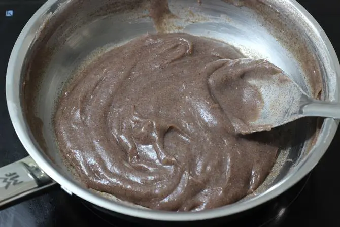 cooking flour mixture to make ragi porridge for babies