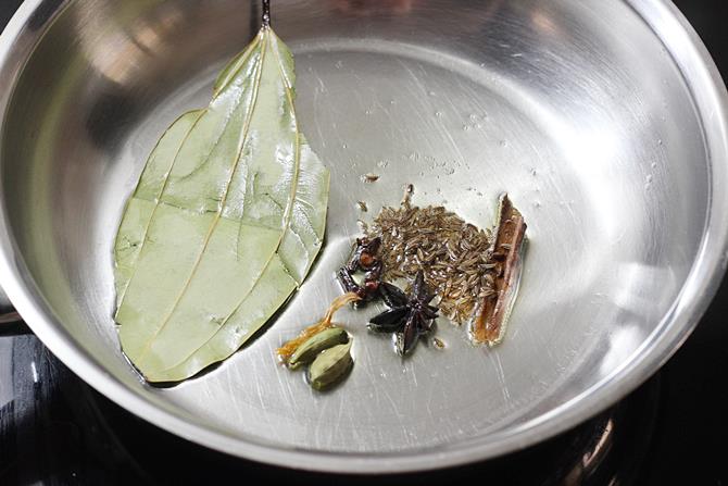 sauteing dry spices in pan for semiya biryani recipe