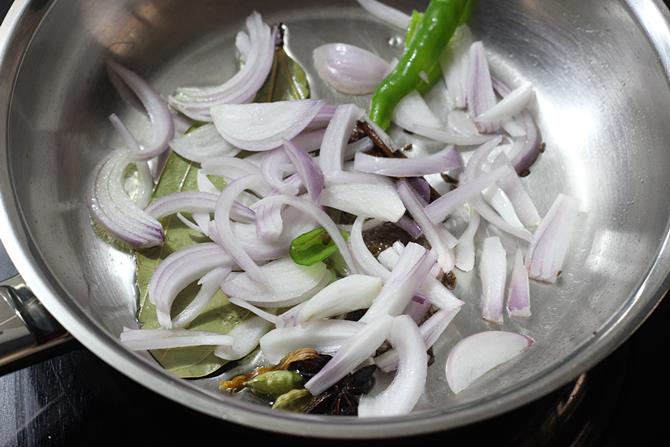 frying thin onions in pan for semiya biryani recipe