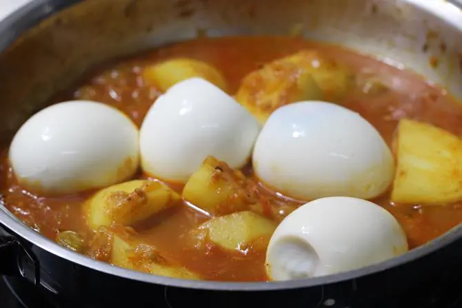 cooked potatoes addition of eggs in aloo egg curry