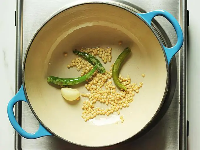 frying till dal turns golden to make peanut chutney