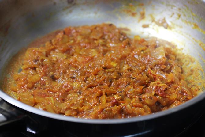 frying onion tomato mixture for potato egg curry recipe