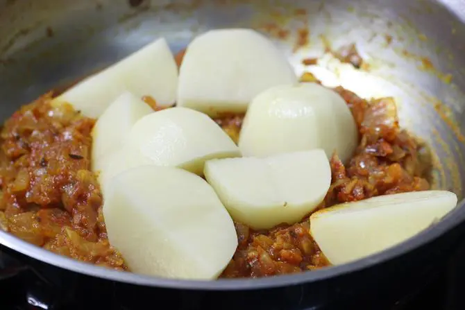 addition of aloo for potato egg curry recipe