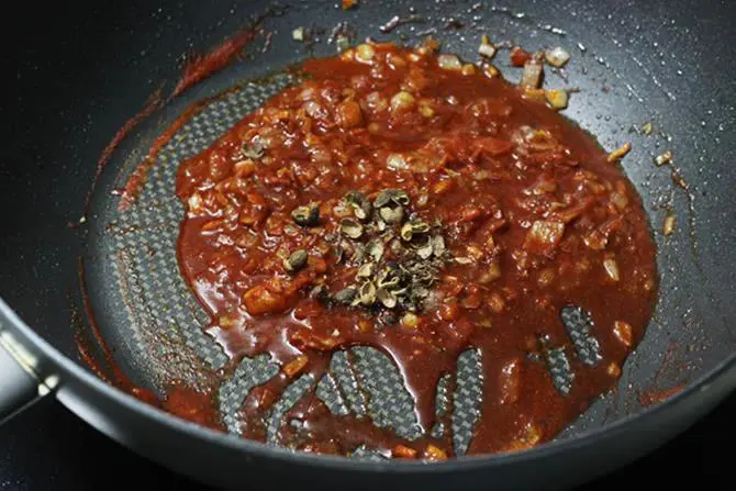 adding sichuan peppers to pan