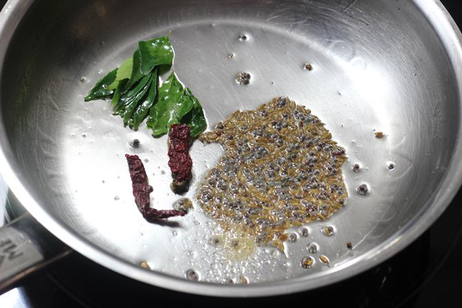 Add mustard, cumin, red chili