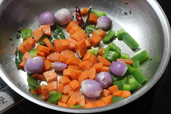 Add sliced onions or shallots, chopped carrots