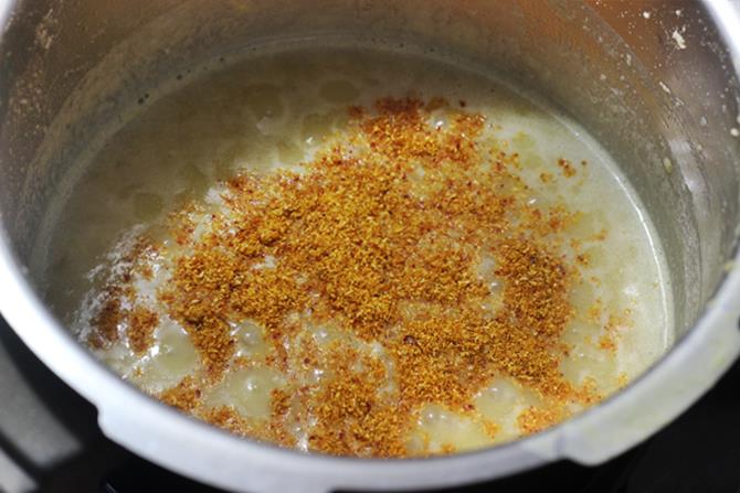 addition of ground spice powder to make sambar oats recipe