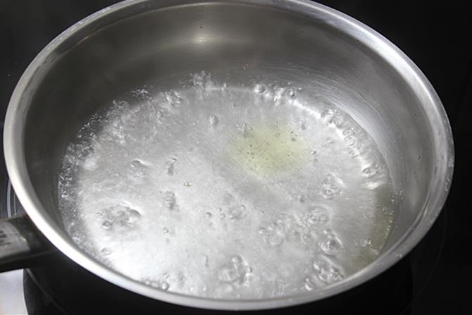Bring one cup water to a rolling boil