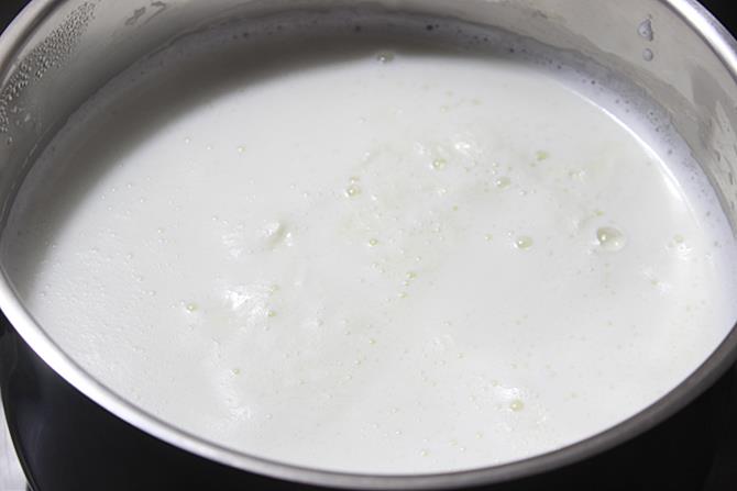 boiling milk to make paneer for malai modak