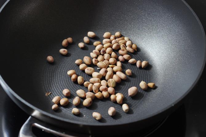 roasting peanuts in skillet for mirchi ka salan recipe