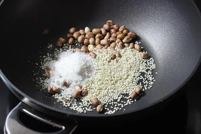 toasting sesame coconut to make mirchi ka salan recipe