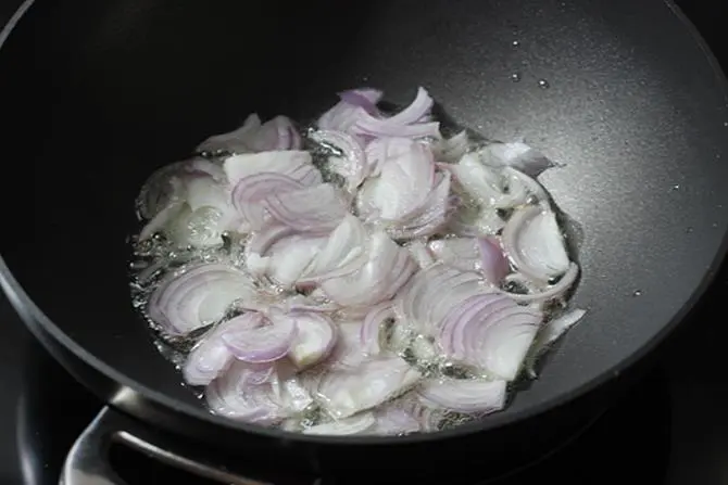 frying onions to make hyderabadi mirchi ka salan