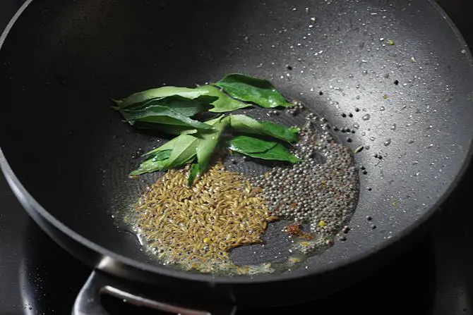 tempering cumin mustard to make mirchi ka salan recipe