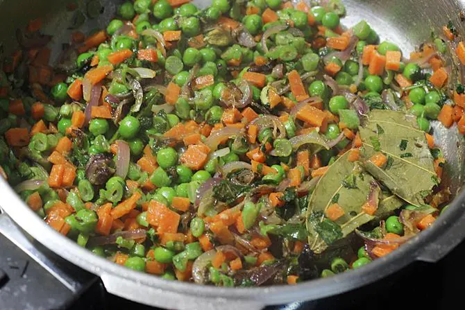 sauteing vegetables to make vegetable pulao recipe