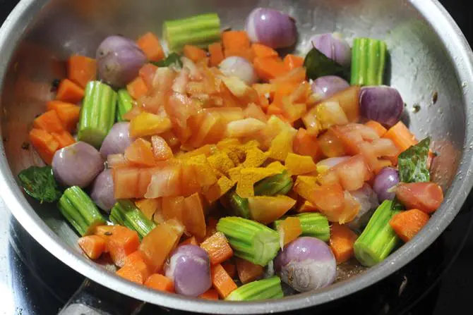 addition of tomatoes to make sambar rice