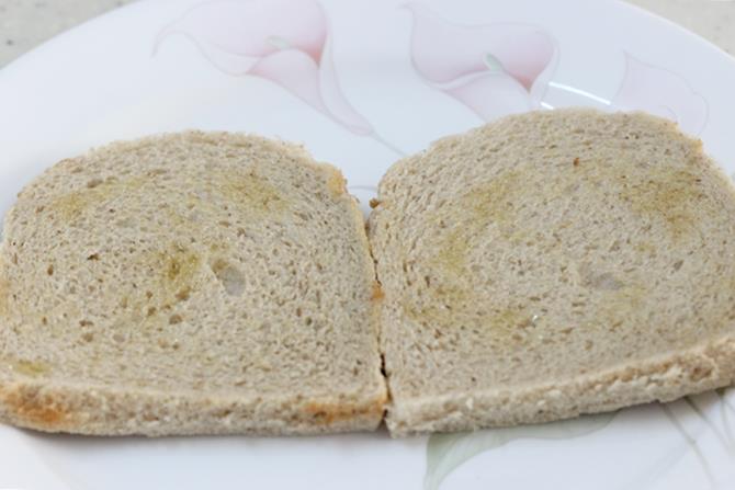 applying ghee on bread