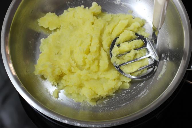 mashing potato for corn patties