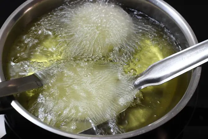 frying spirals to make murukku recipe