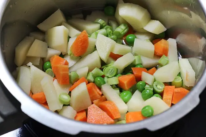 chopping veggies to make veg cutlet recipe