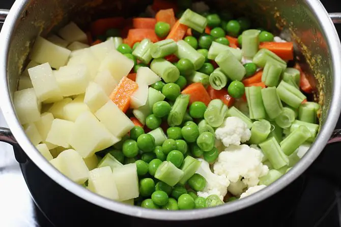 adding chopped veggies