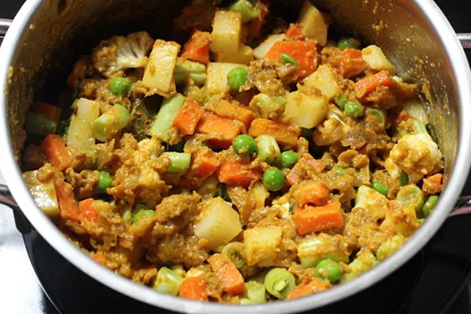 sauteing veggies in masala 